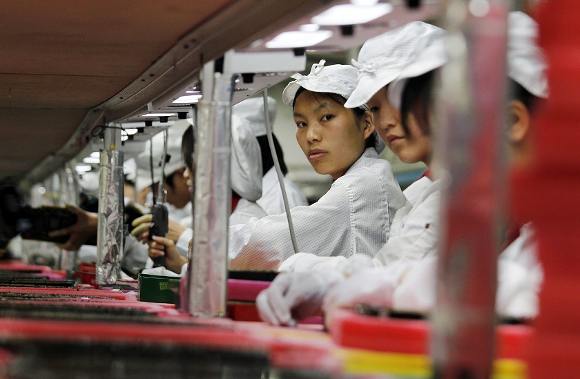 File photo of workers inside a Foxconn factory in the township of Longhua in the southern Guangdong province
